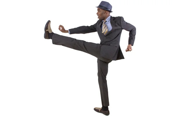 Usinessman doing a karate kick — Stock Photo, Image