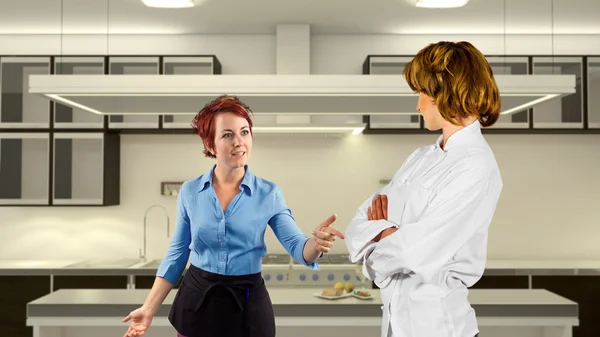 Waitress and chef fighting in a kitchen — Stock Photo, Image