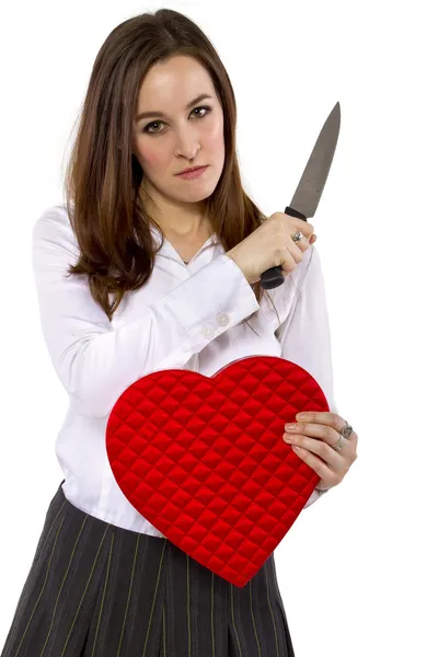 Ex-girlfriend with a heart and knife — Stock Photo, Image