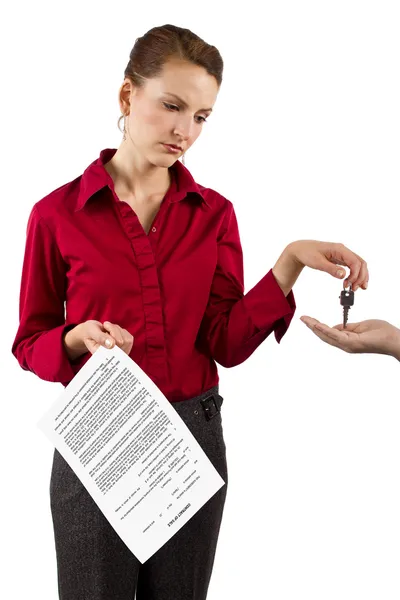 Woman holding keys — Stok fotoğraf