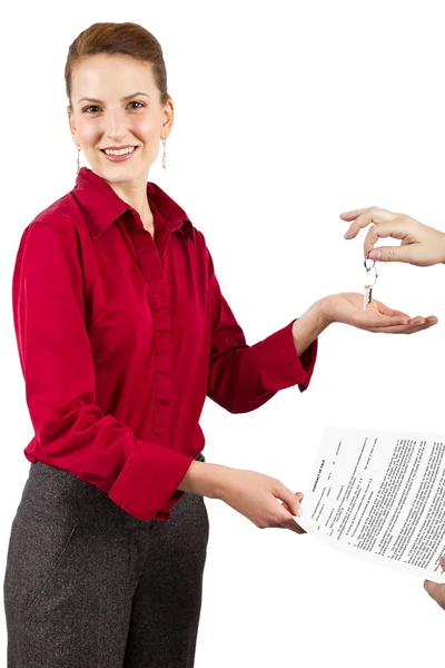 Woman holding keys — Stok fotoğraf