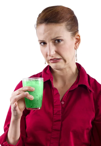 Woman grossed out by vegetable juice — Stock Photo, Image