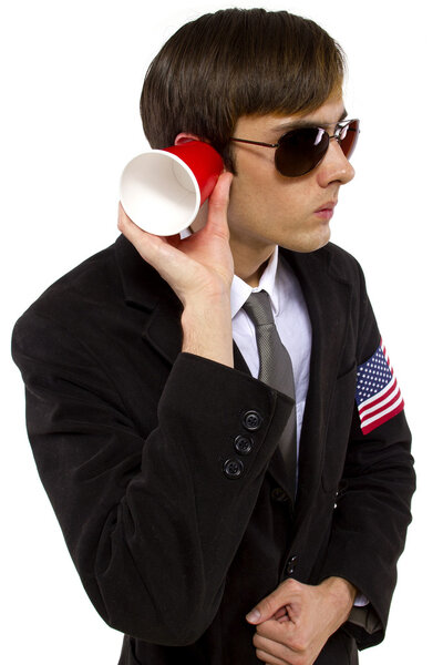 American spy holding cup
