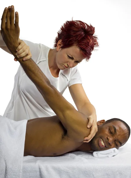 Femmina massaggiatrice male paziente — Foto Stock