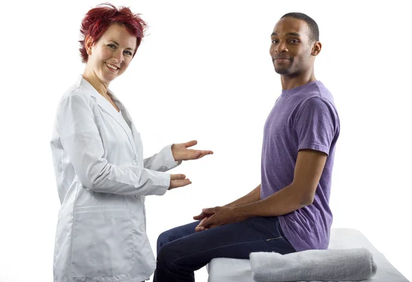 Therapist consulting male about posture — Stock Photo, Image