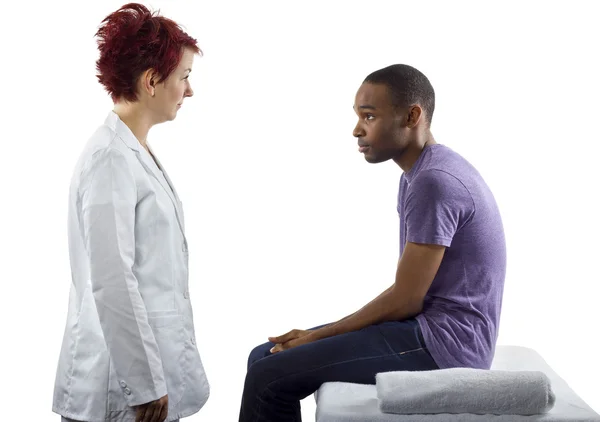 Therapist consulting male about posture — Stock Photo, Image