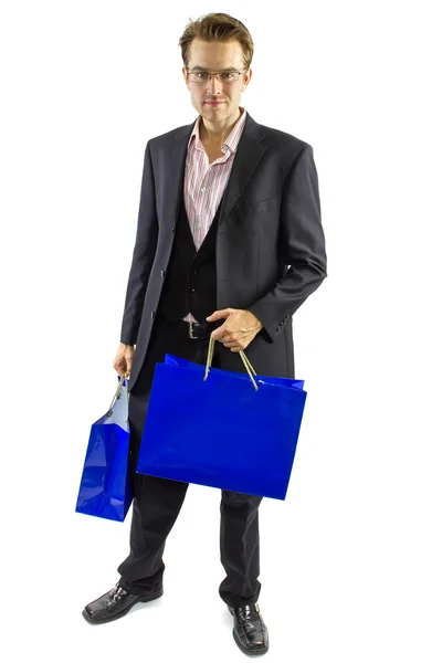 Masculino posando com sacos de compras — Fotografia de Stock