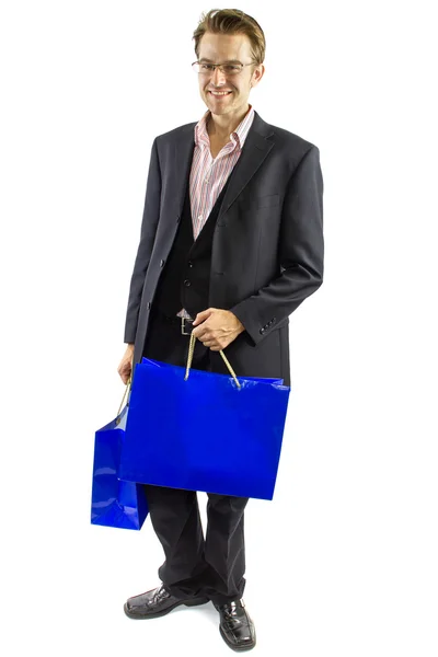 Hombre posando con bolsas de compras — Foto de Stock
