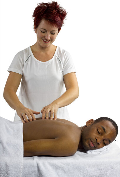 Therapist examining male spinal column