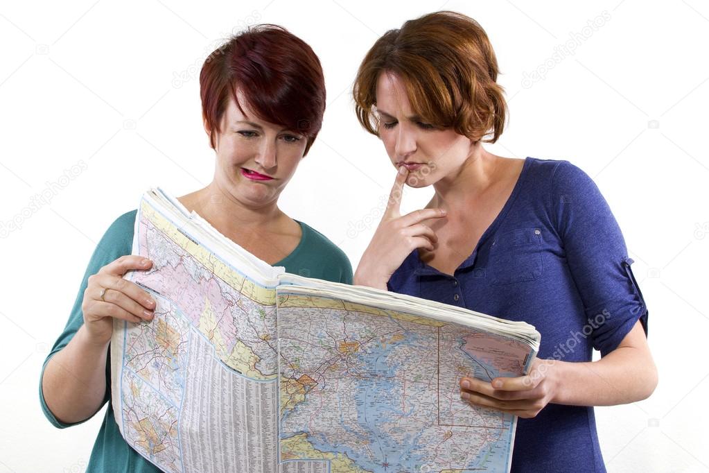 Two women looking at map