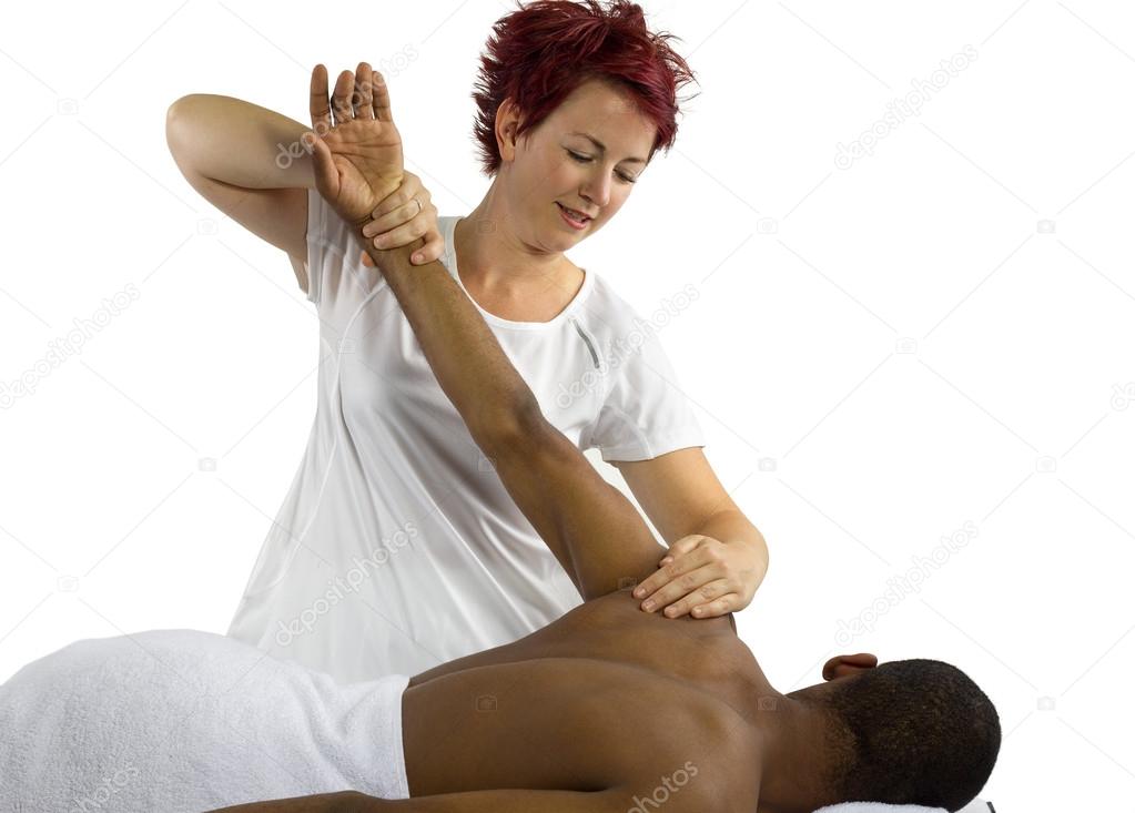 Therapist helping male patient