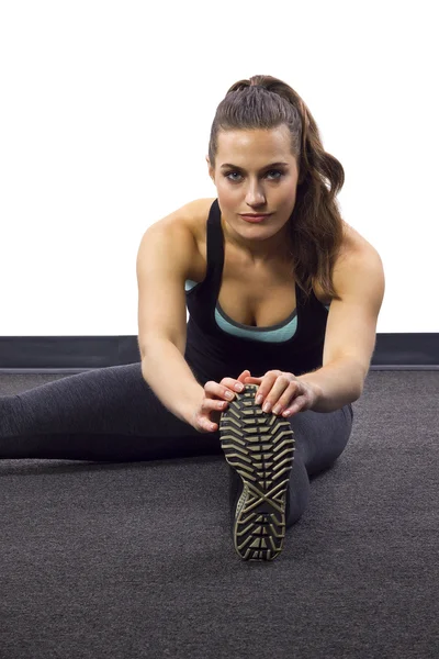 Kvinnliga tränare är stretching — Stockfoto