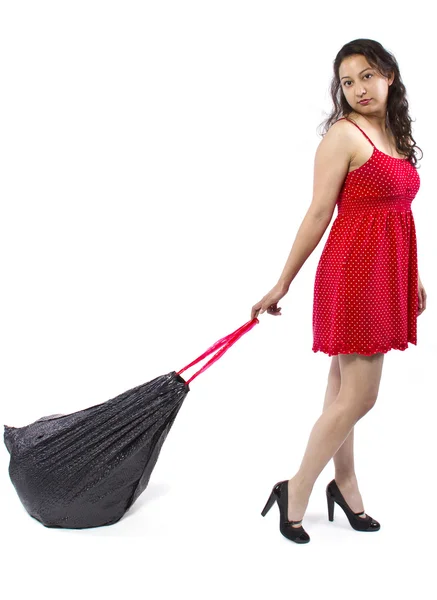 Woman holding black trashbag — 图库照片