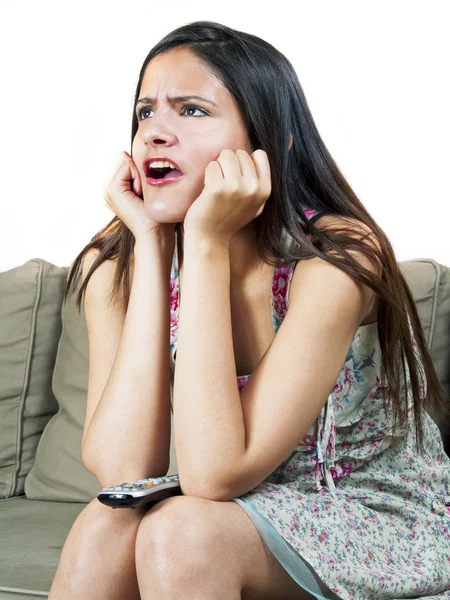 Girl sitting on couch — Stock Photo, Image