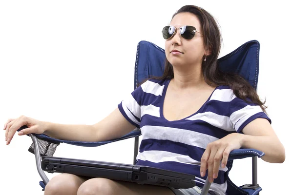 Woman with laptop sitting on chair — Stock Photo, Image