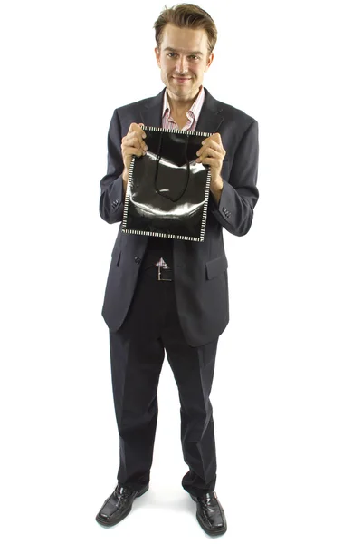 Male presenting gift in bag — Stock Photo, Image