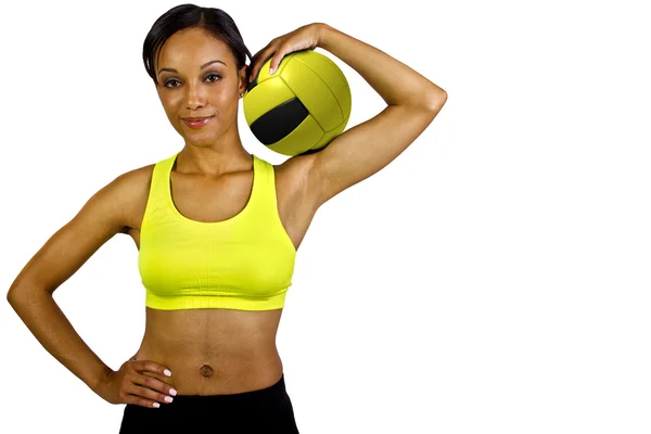 Atleta femenina con voleibol amarillo — Foto de Stock