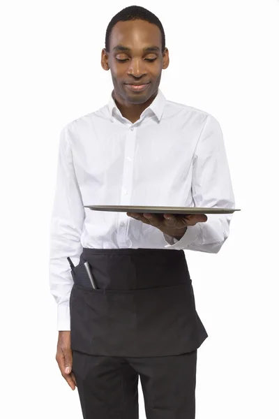 Mężczyzna kelner niosąc tacę puste — Zdjęcie stockowe