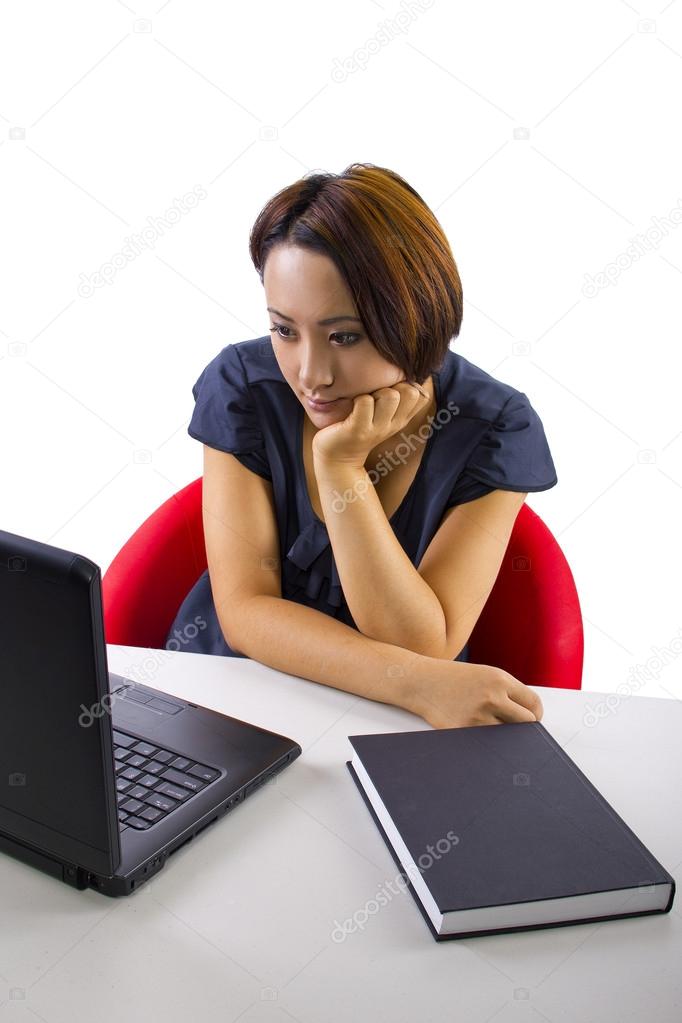 Asian female studying with computer