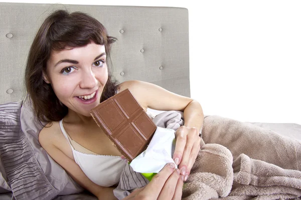 Girl eating junk food before going to bed — Stock Photo, Image