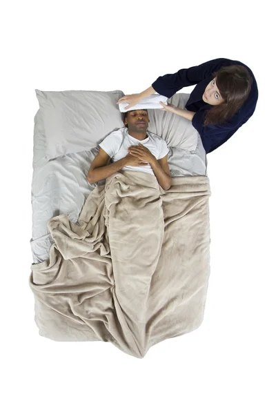 Female taking care of her sick boyfriend in bed — Stock Photo, Image