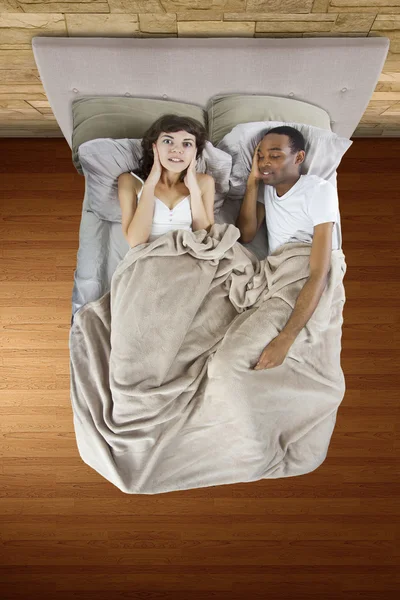 Unable to sleep in bed because of snoring partner — Stock Photo, Image