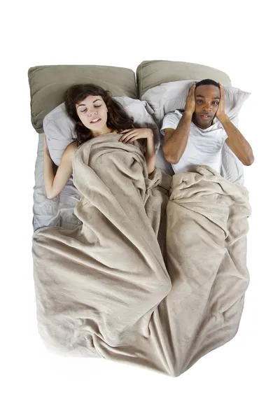 Unable to sleep in bed because of snoring partner — Stock Photo, Image