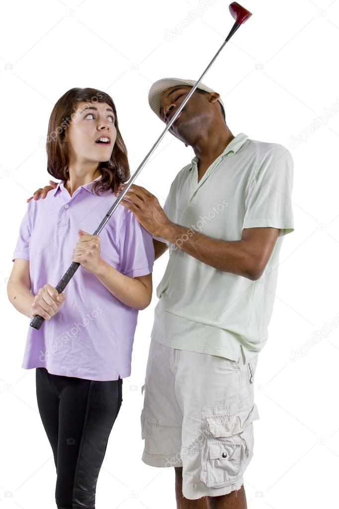 Golf instructor with a teenager student