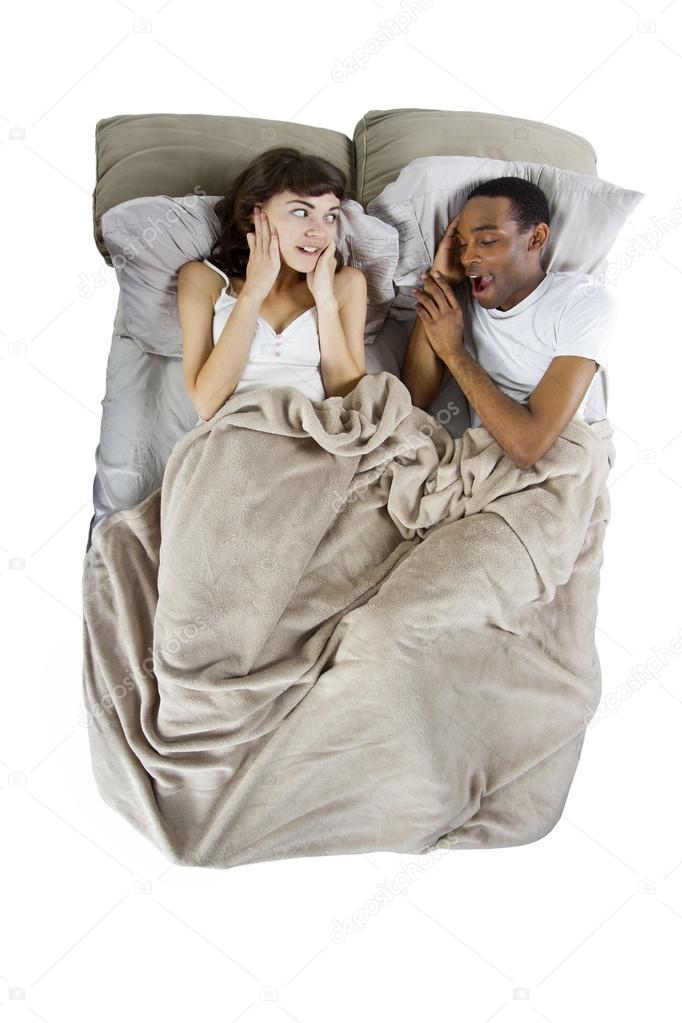 Unable to sleep in bed because of snoring partner