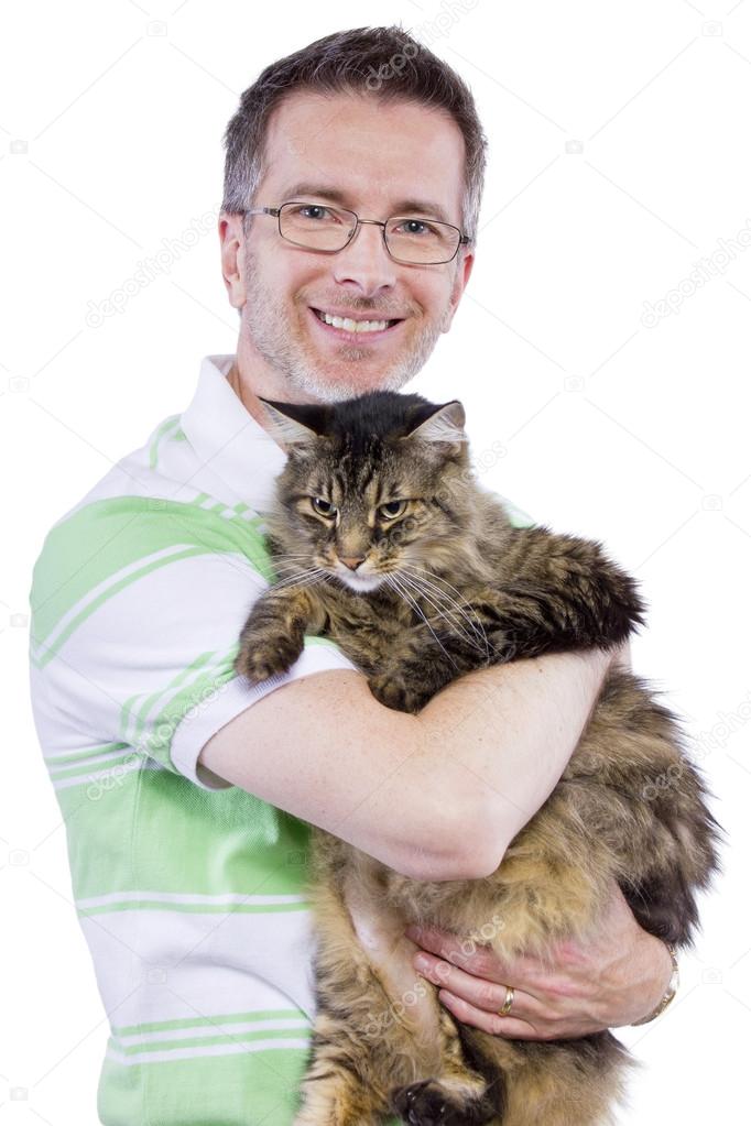 Male embracing a maine coon cat