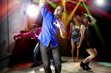 Caucasian man falls in dance club clipart