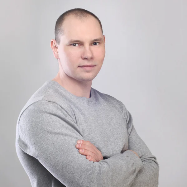 Young man standing confidently — Stock Photo, Image