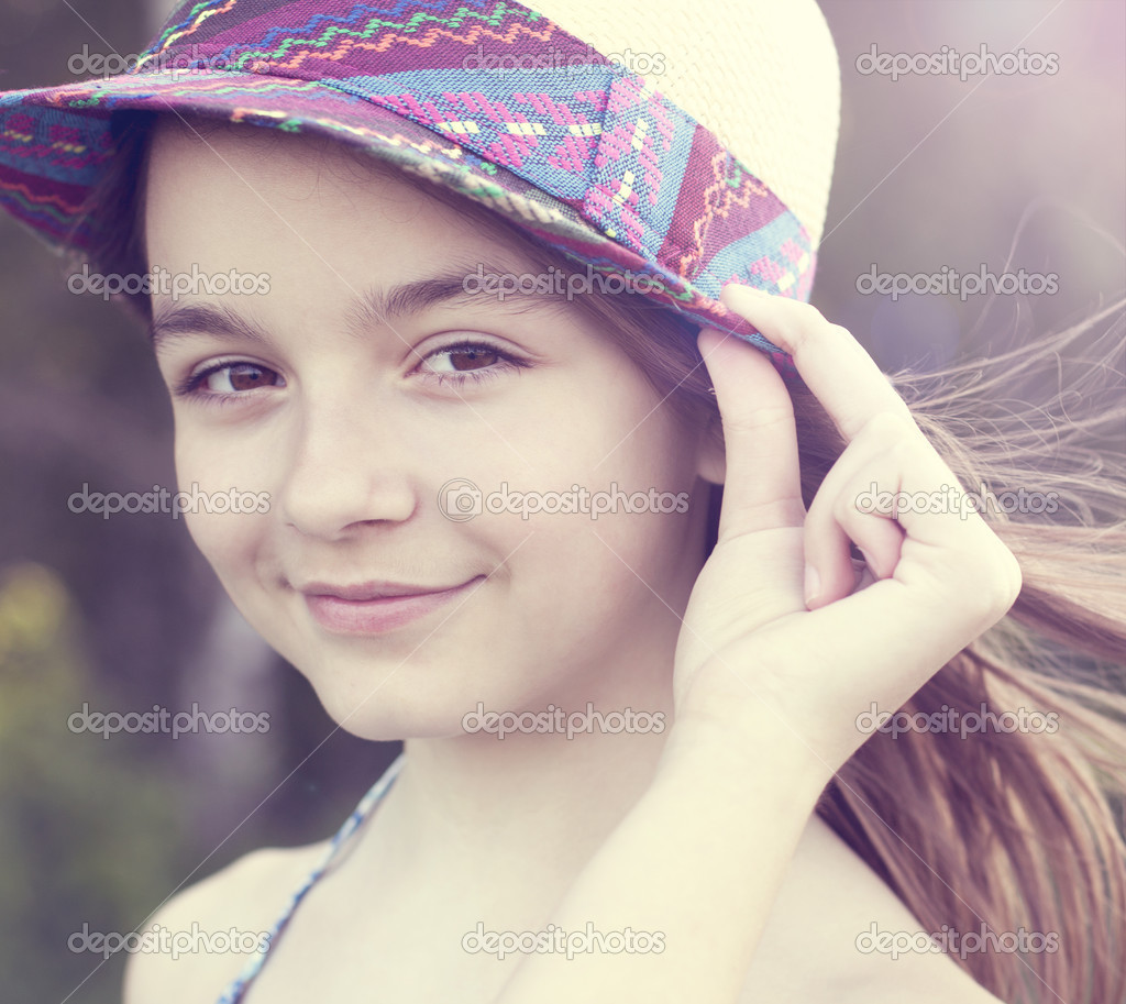 Little girl wearing a hat outdoors Stock Photo by ©byswat 48509525