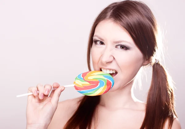 Girl sucks big candy — Stock Photo, Image