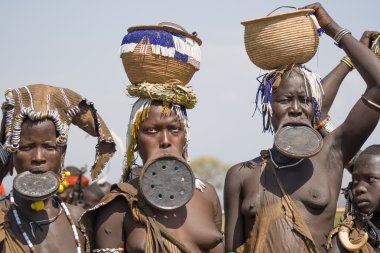 Mursi women with strange lip plates clipart