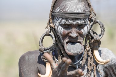 Mursi woman with a strange lip plate clipart