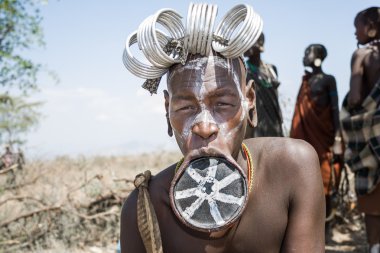 Mursi woman with a strange lip plate clipart