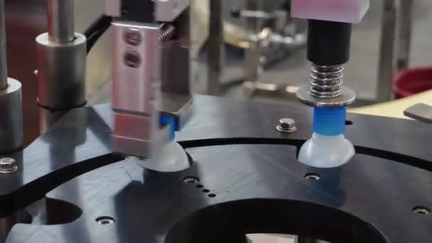 Bottling Machine Putting Caps Plastic Alcohol Bottle Containers Close Shot — Video Stock
