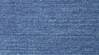 Yakın plan Macro Blue Denim Jeans Düz Kumaş Yüzey Arkaplanı. Tekstil Doku İzleme. Kaydırma Ekran Görüntüsü.