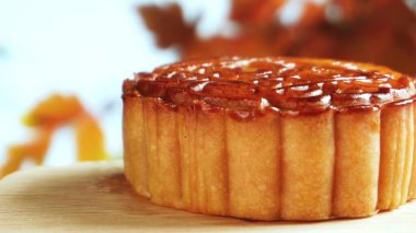 Mooncake being served on wood platter board. Traditional Mid-autumn Festival celebration Chinese food. 