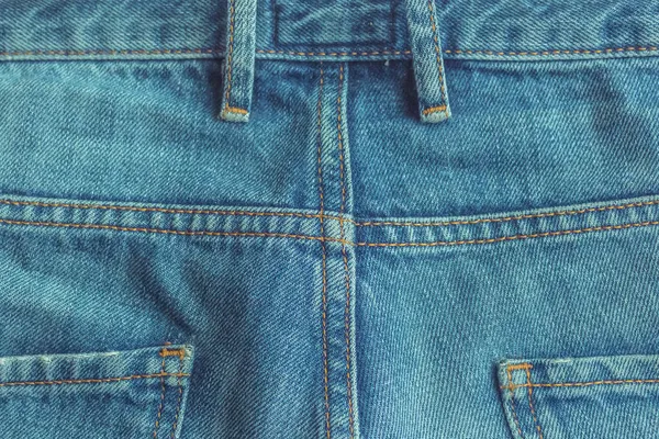 Achterkant van klassieke denim jeans textuur — Stockfoto