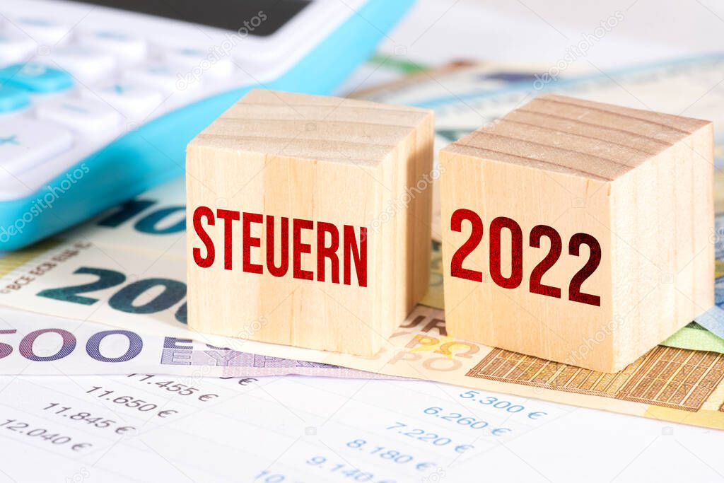 Euro bills, calculators and taxes in 2022