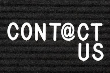 A chalkboard and the word contact