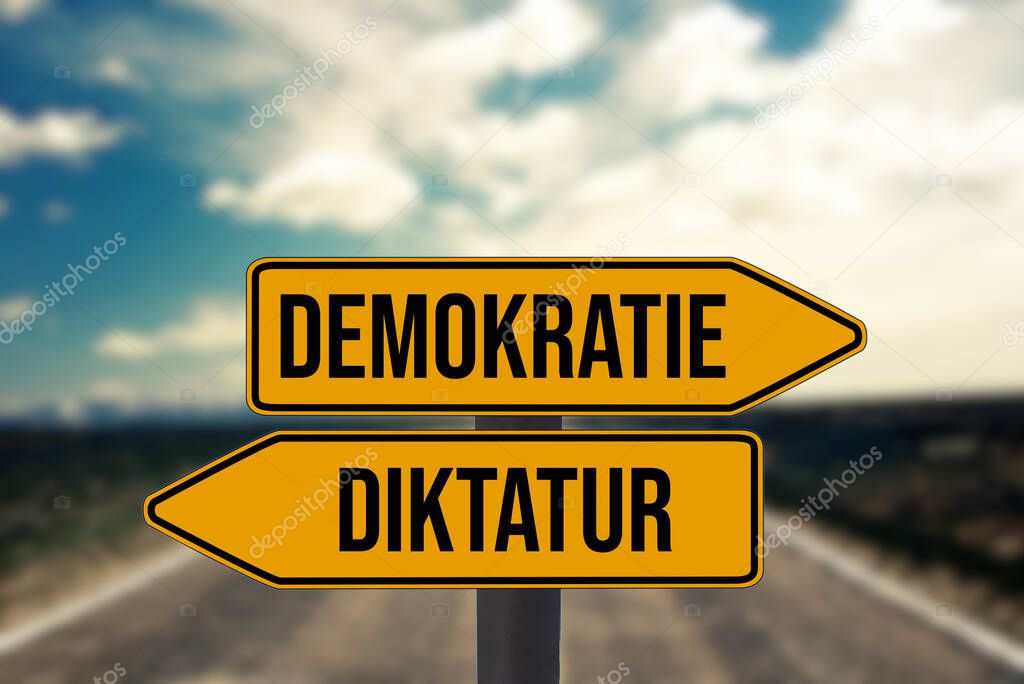 Signposts point to democracy and dictatorship