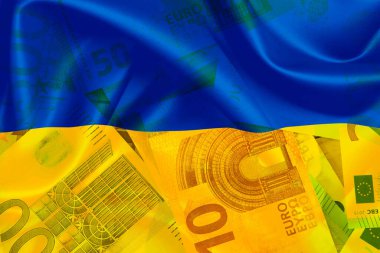 Flag of Ukraine and Euro banknotes