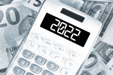 Euro money, calculator and the year 2022