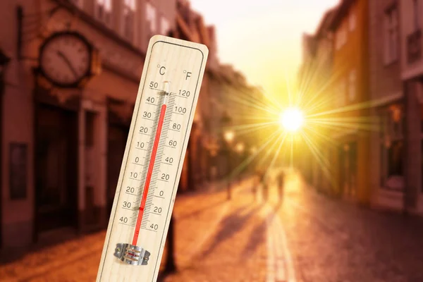 A thermometer and heat in the city