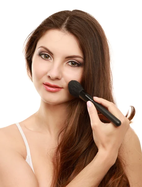 Beautiful young adult woman applying cosmetic paint brush — Stock Photo, Image