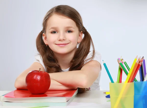 Portrait of cute girl at workplace with the books — Stock Photo, Image