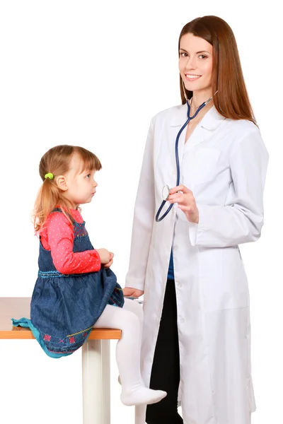 Little girl and young doctor in hospital having examination — Stock Photo, Image